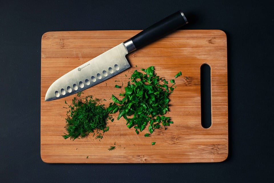 Santoku Knife on a cutting board